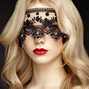 A blonde woman with veil for her eyes.