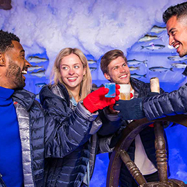 Four people toasting at the Amsterdam Icebar.